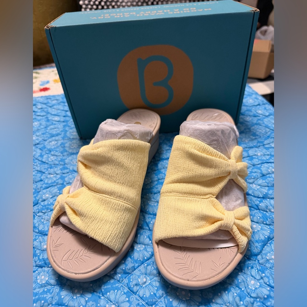 Bzees Smile wedge sandals with a yellow stretch fabric upper and knotted bow